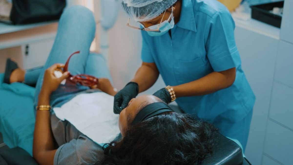 Female dentist treating a female patient (illustrative stock photo)